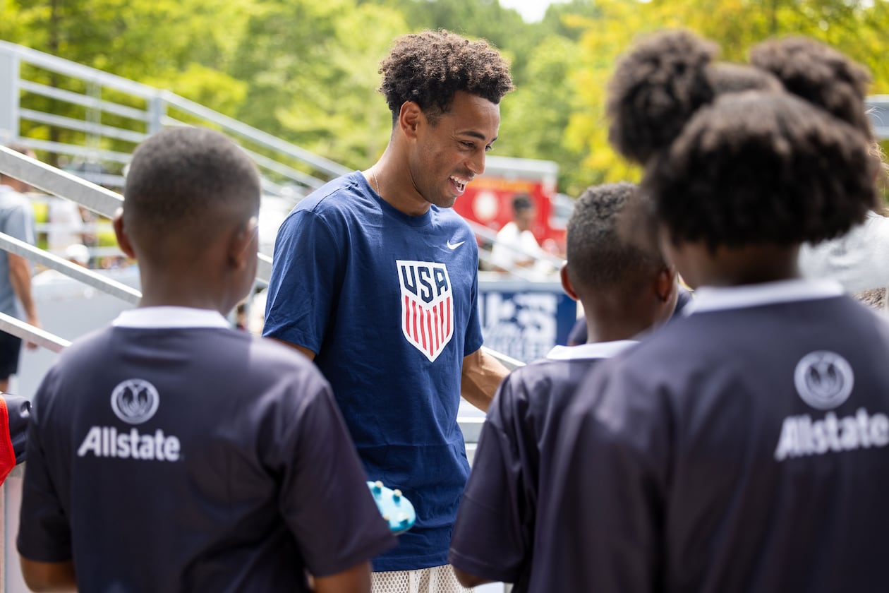 U.S. men's national team player Tyler Adams (center) participates in the unveiling of a minipitch at Sandtown Park in South Fulton on Tuesday, July 21, 2026. (Courtesy of Jenn Finch/Rank Studios)