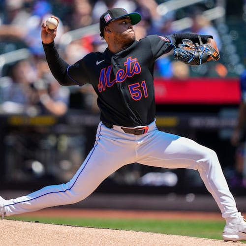 New York Mets pitcher Freddy Peralta (51) throws during the first inning of a baseball game against the Los Angeles Dodgers, Sunday, July 26, 2026, in New York. (AP Photo/Yuki Iwamura)