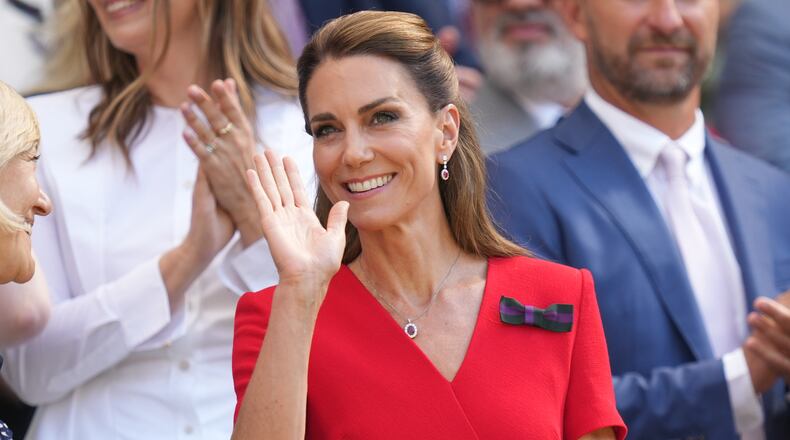 Britain's Princess Kate waves from the royal box on day 13 of the Wimbledon Tennis Championships in London, Saturday, July 11, 2026. (AP Photo/Kirsty Wigglesworth)