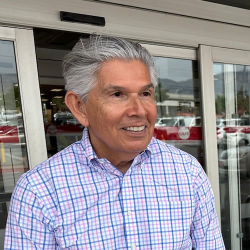 FILE - Republican gubernatorial candidate Duke Rodriguez talks with a voter in Albuquerque, N.M., Tuesday, June 2, 2026. (AP Photo/Susan Montoya Bryan, File)