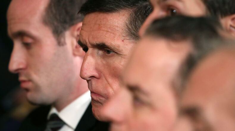 Former National Security Adviser Michael Flynn (2ndL) attends a joint news conference with U.S. President Donald Trump and Canadian Prime Minister Justin Trudeau in the East Room of the White House February 13, 2017 in Washington, DC.