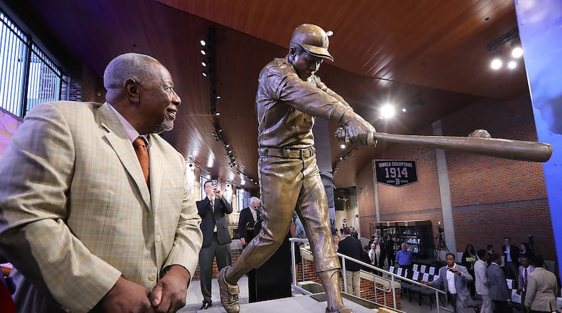 Hank Aaron beside his statue at SunTrust Park. Curtis Compton/ccompton@ajc.com