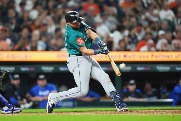 Seattle Mariners' Cal Raleigh hits a grand slam against the Detroit Tigers in the ninth inning during a baseball game, Friday, July 11, 2025, in Detroit. (AP Photo/Paul Sancya)