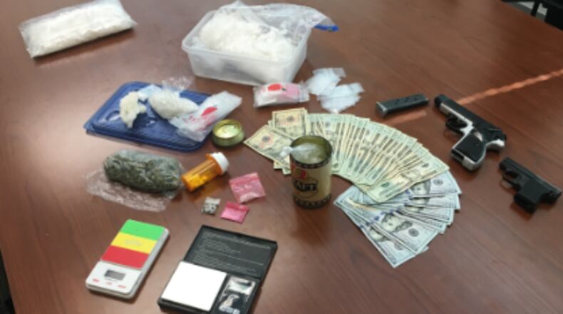 A traffic stop in Douglas County led authorities to 1.6 pounds of methamphetamine, marijuana, two handguns and about two dozen Xanax tablets.