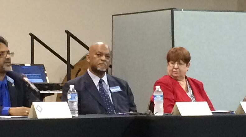 Gwinnett Democratic Party Chairman Jim Shealey (center) lost to incumbent Republican Charlotte Nash (right) in Tuesday’s election.