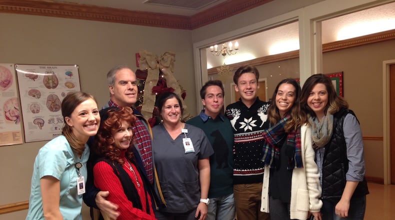 After a viral attack, former Georgia Tech football player Mike Darby was expected to die in June but is now healthy. He visited the Gainesville rehabilitation facility last Thursday to visit residents and thank therapists. In the photo, left to right: Physical therapist Carleigh Turner, wife Deana, Darby, occupational therapist Becky Lesco, sons Brendon and Nicholas and daughters Natalie and Stefanie.