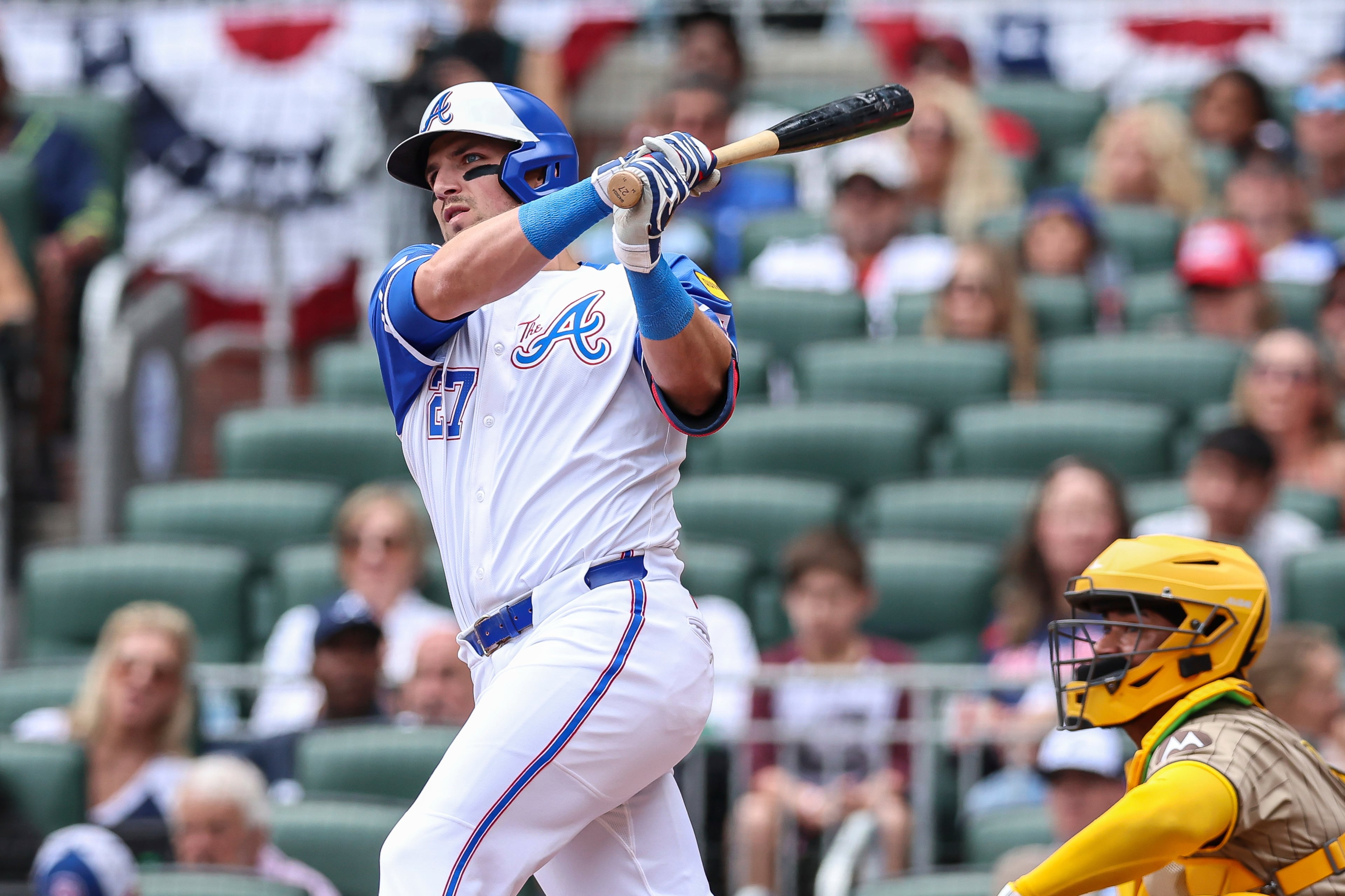 Atlanta Braves' Austin Riley (27) hits a double in the third inning of a baseball game against the San Diego Padres, Saturday, May 24, 2025, in Atlanta. (AP Photo/Colin Hubbard)