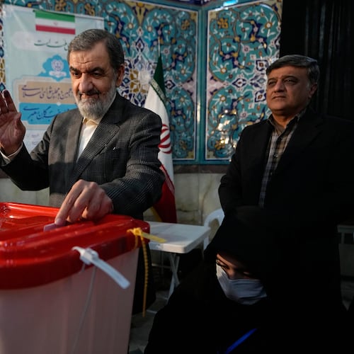 FILE - Former Revolutionary Guard commander Mohsen Rezaei casts his ballot during the parliamentary and Assembly of Experts elections at a polling station in Tehran, Iran, March 1, 2024. (AP Photo/Vahid Salemi, File)
