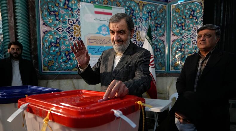 FILE - Former Revolutionary Guard commander Mohsen Rezaei casts his ballot during the parliamentary and Assembly of Experts elections at a polling station in Tehran, Iran, March 1, 2024. (AP Photo/Vahid Salemi, File)