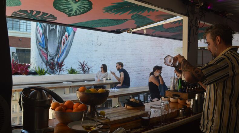 The bartenders at 8ARM have everything they need inside the shipping container bar that serves the patio area.