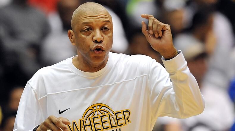 the Pebblebrook Falcons in the Georgia High School Basketball championships at the Macon Coliseum, Saturday, March 7, 2015. The Wheeler Wildcats led Pebblebrook Falcons 28-25 at the half. KENT D. JOHNSON/KDJOHNSON@AJC.COM Coach Doug Lipscomb's Wheeler Wildcats are the host team for the Tournament of Champions Holiday Classic
