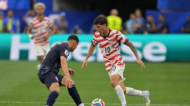 United States' Christian Pulisic (10) dribbles past Paraguay's Juan Jose Caceres during the World Cup Group D soccer match in Inglewood, Calif., near Los Angeles, Friday, June 12, 2026. (AP Photo/Jayne Kamin-Oncea)
