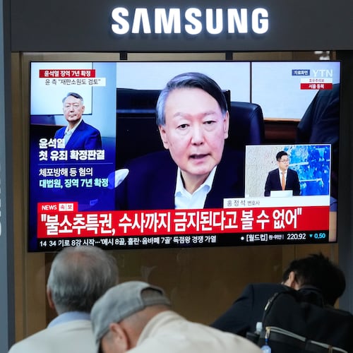 A TV screen shows an image of former South Korea President Yoon Suk Yeol during a news program at the Seoul Railway Station in Seoul, South Korea, Thursday, July 9, 2026. (AP Photo/Ahn Young-joon)