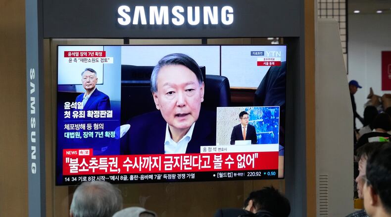 A TV screen shows an image of former South Korea President Yoon Suk Yeol during a news program at the Seoul Railway Station in Seoul, South Korea, Thursday, July 9, 2026. (AP Photo/Ahn Young-joon)