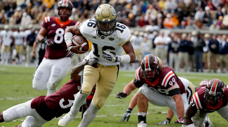 Georgia Tech quarterback TaQuon Marshall runs the ball past the reach of Virginia Tech's Greg Stroman to score a touchdown in the first quarter of an NCAA college football game in Atlanta, Saturday, Nov. 11, 2017. (AP Photo/David Goldman)
