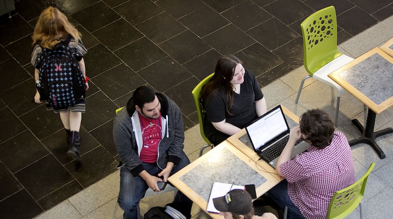 Students study in the Atrium Building on the Kennesaw State University Marietta Campus. AJC/PHIL SKINNER