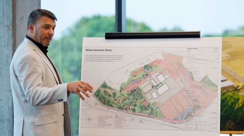 Jimmy Knauf, executive vice president of facilities at Rivian, describes the design of the Stanton Springs plant, based on a rendering, after touring Rivian’s East Coast headquarters in Atlanta on Tuesday, Aug. 4, 2026. (Miguel Martinez/AJC)