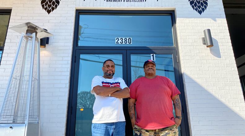 Owner Clarence Boston (left) and brewer Kevin Blodger are seen in front of Hippin Hops Brewery and Distillery in East Lake. Bob Townsend for The Atlanta Journal Constitution