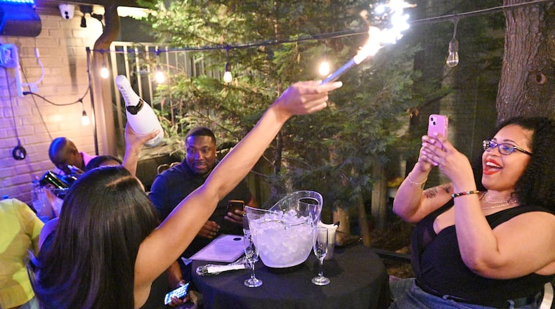 Guests enjoy drinks and music at Whisky Mistress in Buckhead on Saturday, April 30, 2022. (Hyosub Shin / Hyosub.Shin@ajc.com)