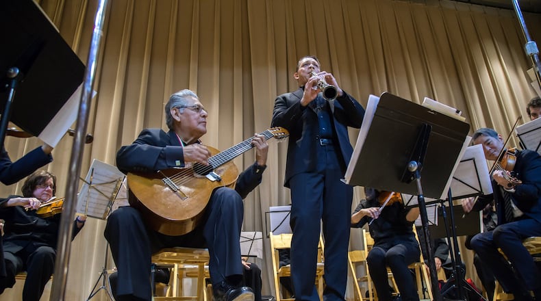 ASO violinist Juan Ramirez plays Spanish guitar during a performance at the Day of the Dead celebration at the Atlanta History in October. Contributed by Steve Schaefer