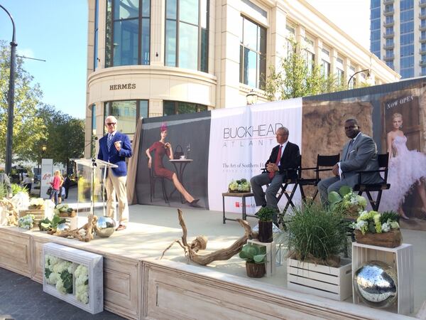 Dene Oliver (left), the CEO of Buckhead Atlanta developer OliverMcMillan, addresses attendees at the grand opening of the $1 billion project which started as the Streets of Buckhead under developer Ben Carter and stalled during the recession before OliverMcMillan took over. J. Scott Trubey/STAFF Thursday, Sept. 18, 2014.