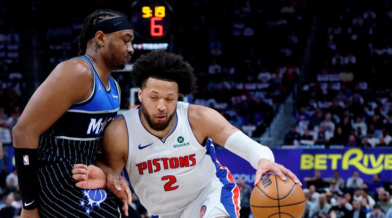 Detroit Pistons guard Cade Cunningham (2) drives against Orlando Magic center Wendell Carter Jr. (34) during the first half in Game 5 of a first-round NBA basketball playoffs series Wednesday, April 29, 2026, in Detroit. (AP Photo/Duane Burleson)