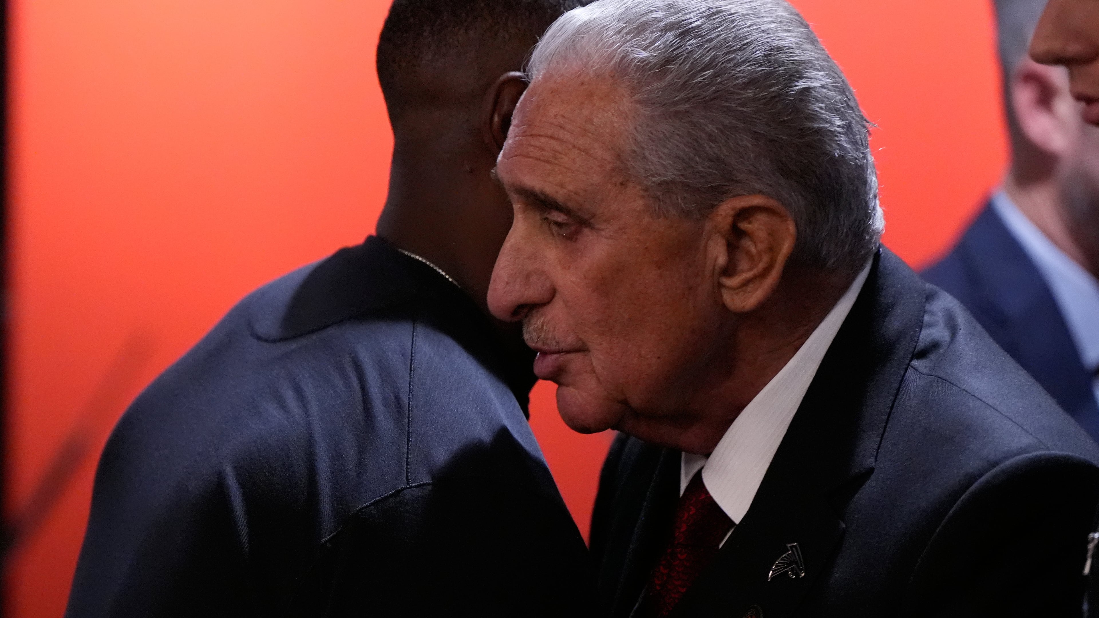 Atlanta Falcons owner Arthur Blank, facing, greets head coach Raheem Morris after a loss to the Seattle Seahawks in an NFL football game, Sunday, Dec. 7, 2025, in Atlanta. (Mike Stewart/AP)