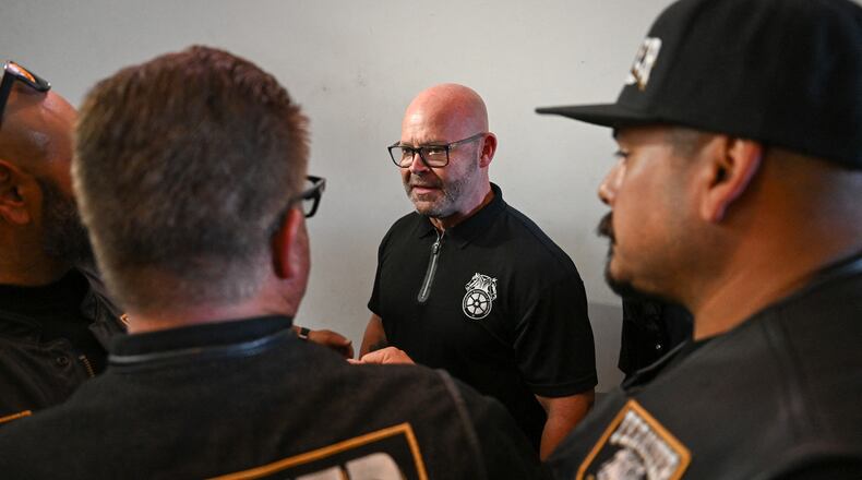 Teamsters General President Sean M. O'Brien shakes hands with workers during a rally in August in support of the unionization of Amazon delivery drivers in California. That organizing campaign has now spread to Atlanta. (Patrick T. Fallon/AFP/Getty Images/TNS)