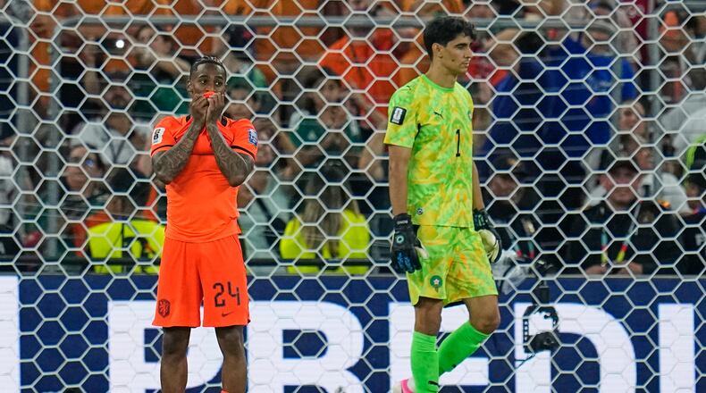 Netherlands' Crysencio Summerville (24) reacts after missing a penalty as Morocco goalkeeper Yassine Bounou (1) walks past during the World Cup round of 32 soccer match between the Netherlands and Morocco in Guadalupe, near Monterrey, Mexico, Monday, June 29, 2026. (AP Photo/Ricardo Mazalan)