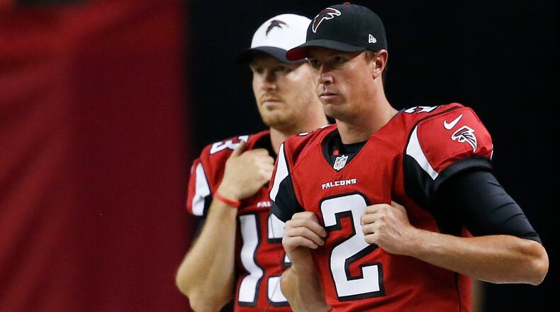 Atlanta Falcons quarterback Matt Ryan (2) and Atlanta Falcons quarterback T.J. Yates (13) watch Atlanta Falcons quarterback Sean Renfree work against the Baltimore Ravens during the first half of a preseason game, Thursday, Sept. 3, 2015, in Atlanta. (John Bazemore/AP)