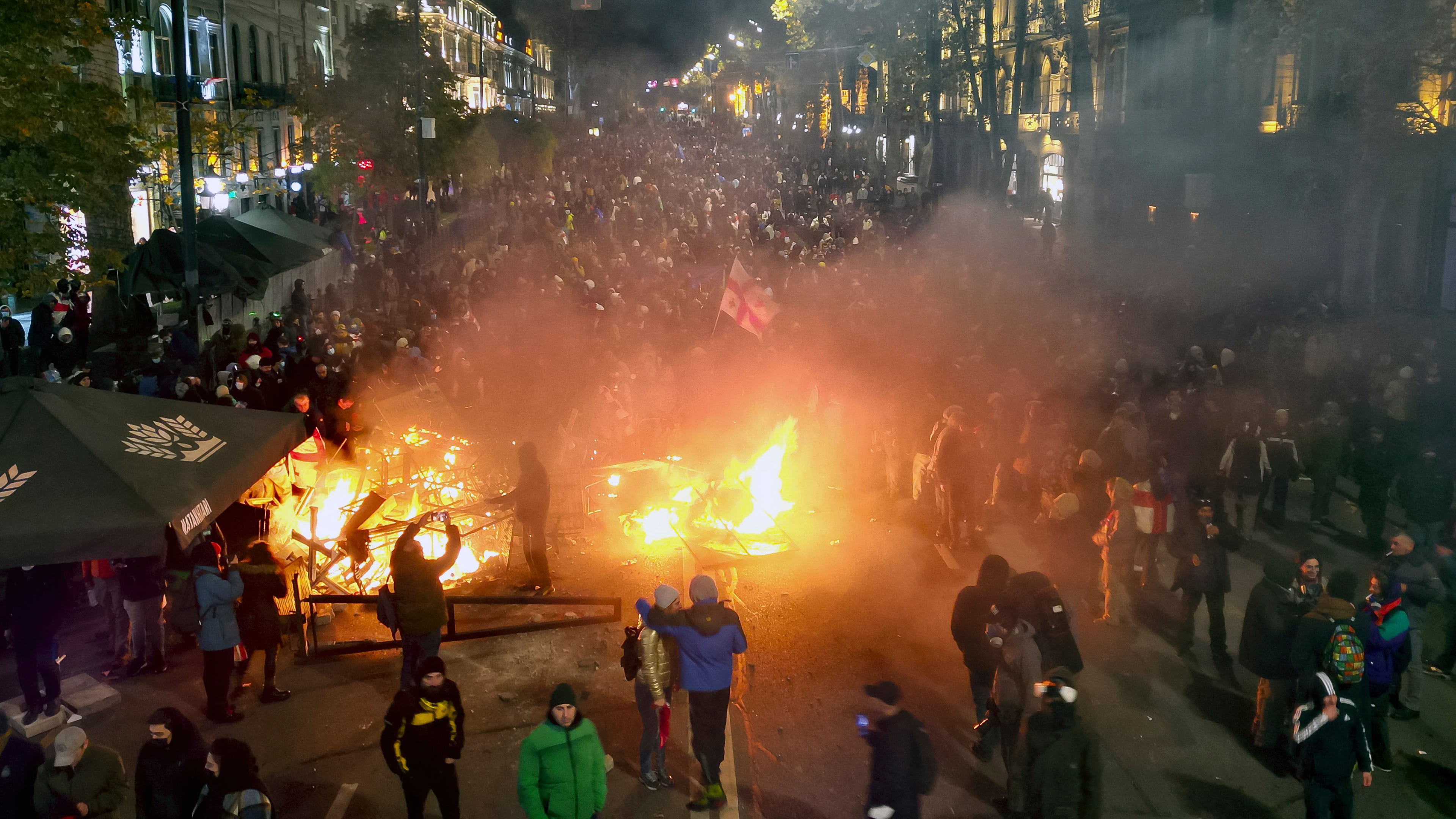 FILE - Protesters pour into the streets outside the parliament building in Tbilisi, Georgia, on Friday, Nov. 29, 2024. (AP Photo/Zurab Tsertsvadze, File)