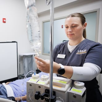 Catherine Costner trains in Mercer University’s nursing simulation lab at its Macon campus. (Courtesy of Leah Yetter)