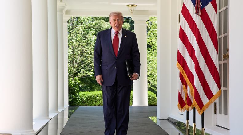 President Donald Trump walks through the Colonnade of the White House as he arrives to attend a luncheon for mothers Friday, May 8, 2026, in the Rose Garden of the White House, in Washington. (AP Photo/Jacquelyn Martin)