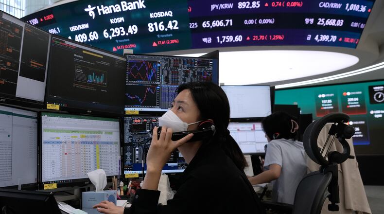 A currency trader talks on the phone at the foreign exchange dealing room of the Hana Bank headquarters in Seoul, South Korea, Monday, Aug. 10, 2026. (AP Photo/Ahn Young-joon)