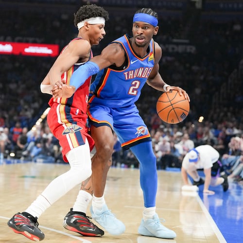 Oklahoma City Thunder guard Shai Gilgeous-Alexander (2) pushes past New Orleans Pelicans guard Jeremiah Fears, left, during the first half of an NBA basketball game, Sunday, Nov. 2, 2025, in Oklahoma City. (AP Photo/Kyle Phillips)