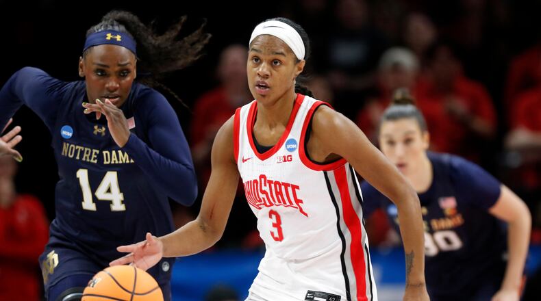 FILE - Ohio State guard Kennedy Cambridge (3) brings the ball downcourt past Notre Dame guard KK Bransford (14) during the first half in the second round of the NCAA college basketball tournament, March 23, 2026, in Columbus, Ohio. (AP Photo/Tom E. Puskar, File)
