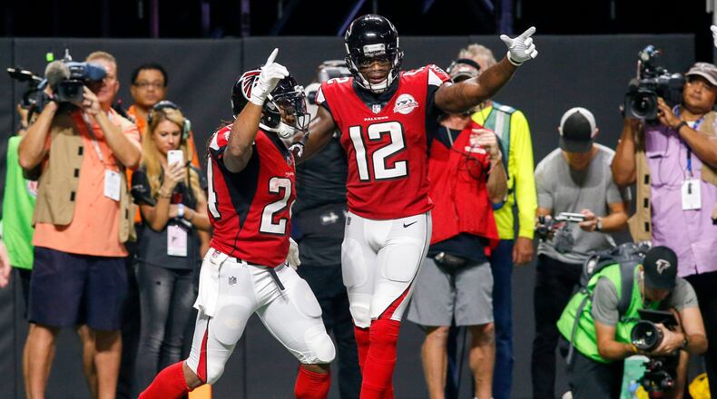 Atlanta Falcons running back Devonta Freeman, left, celebrates a touchdown with wide receiver Mohamed Sanu in a Week 2 win over the Green Bay Packers.