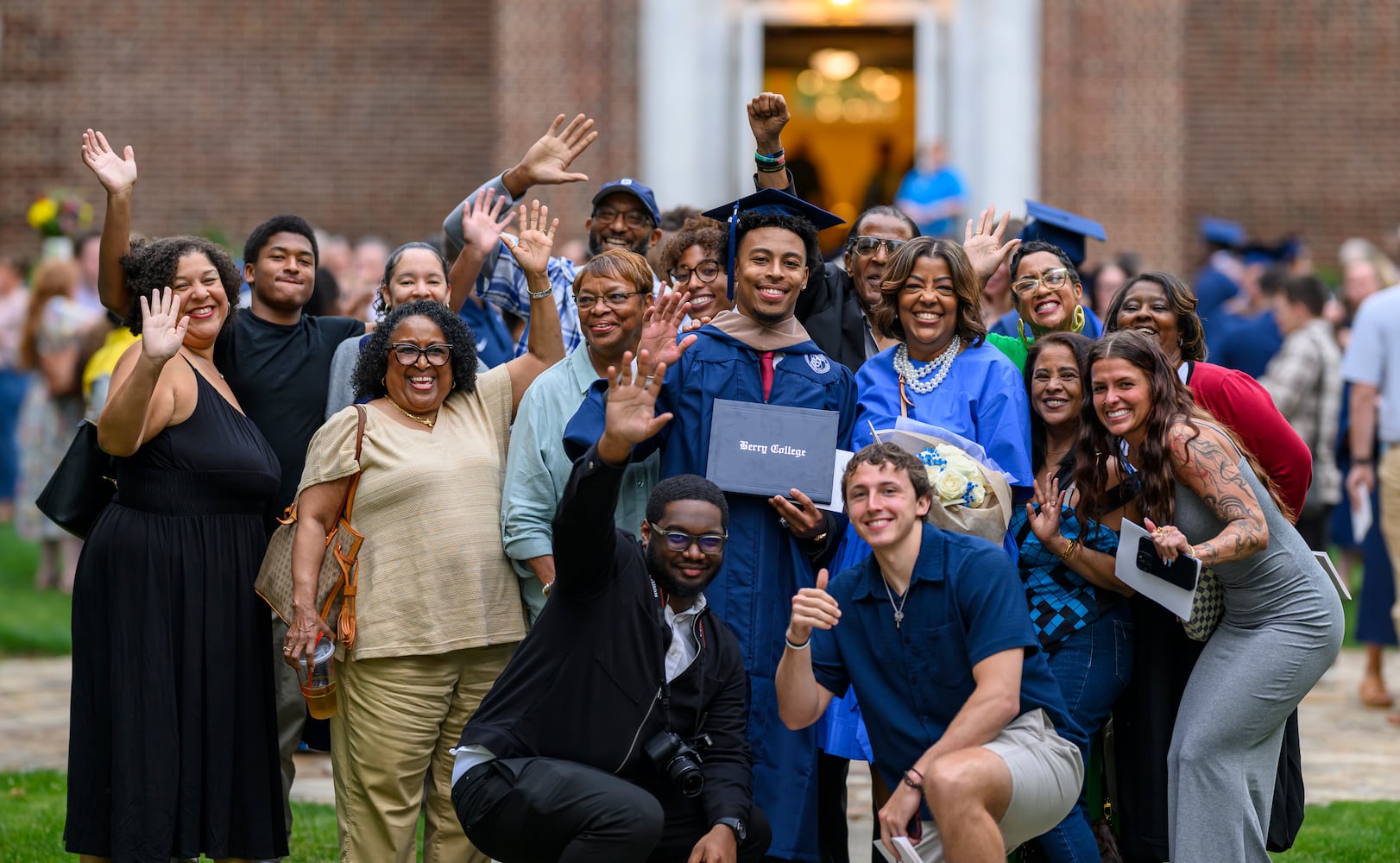 Berry College graduate Andrew Lewis celebrates his MBA degree with family and friends following the graduate commencement ceremony on Friday, May 8, 2026. (Brant Sanderlin/Berry College)  