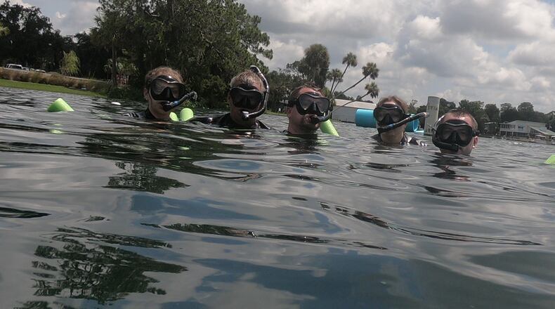 From left, Nicky Christiansen, Mike Christiansen Sr., Mike Christiansen Jr., Kathleen Christiansen and Anthony Christiansen go on a Manatee Tour and Dive manatee snorkeling tour on July 21, 2018, in Kings Bay in Crystal River. (Kathleen Christiansen/Orlando Sentinel/TNS)