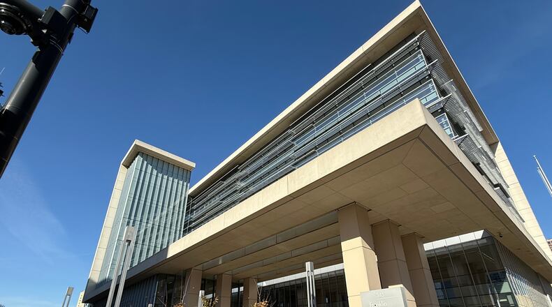 A person stands outside of the Franklin County Common Pleas Courthouse on Thursday, Nov. 13, 2025, in Columbus, Ohio. (AP Photo/Patrick Aftoora-Orsagos)
