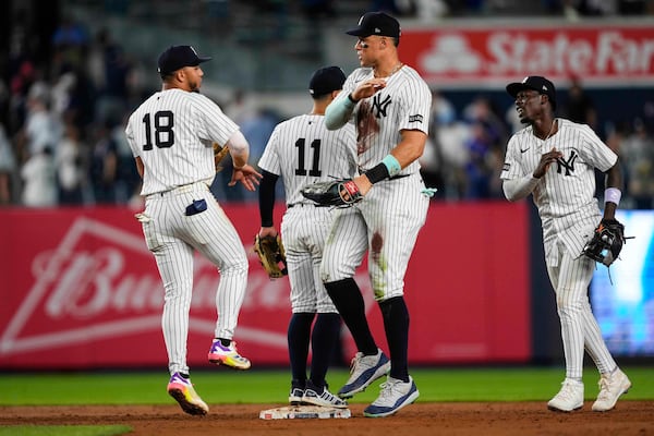 New York Yankees players, including outfielder Aaron Judge, second from right, celebrate after winning a baseball game against the Chicago Cubs, Friday, July 11, 2025, in New York. (AP Photo/Yuki Iwamura)