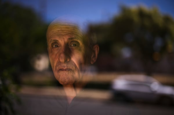 Kamran Afary, an associate professor of communication at California State University, Los Angeles, who immigrated from Iran in the 1970s, stands for a photo in the "Tehrangeles" neighborhood of Los Angeles Sunday, June 29, 2025. (AP Photo/Jae C. Hong)