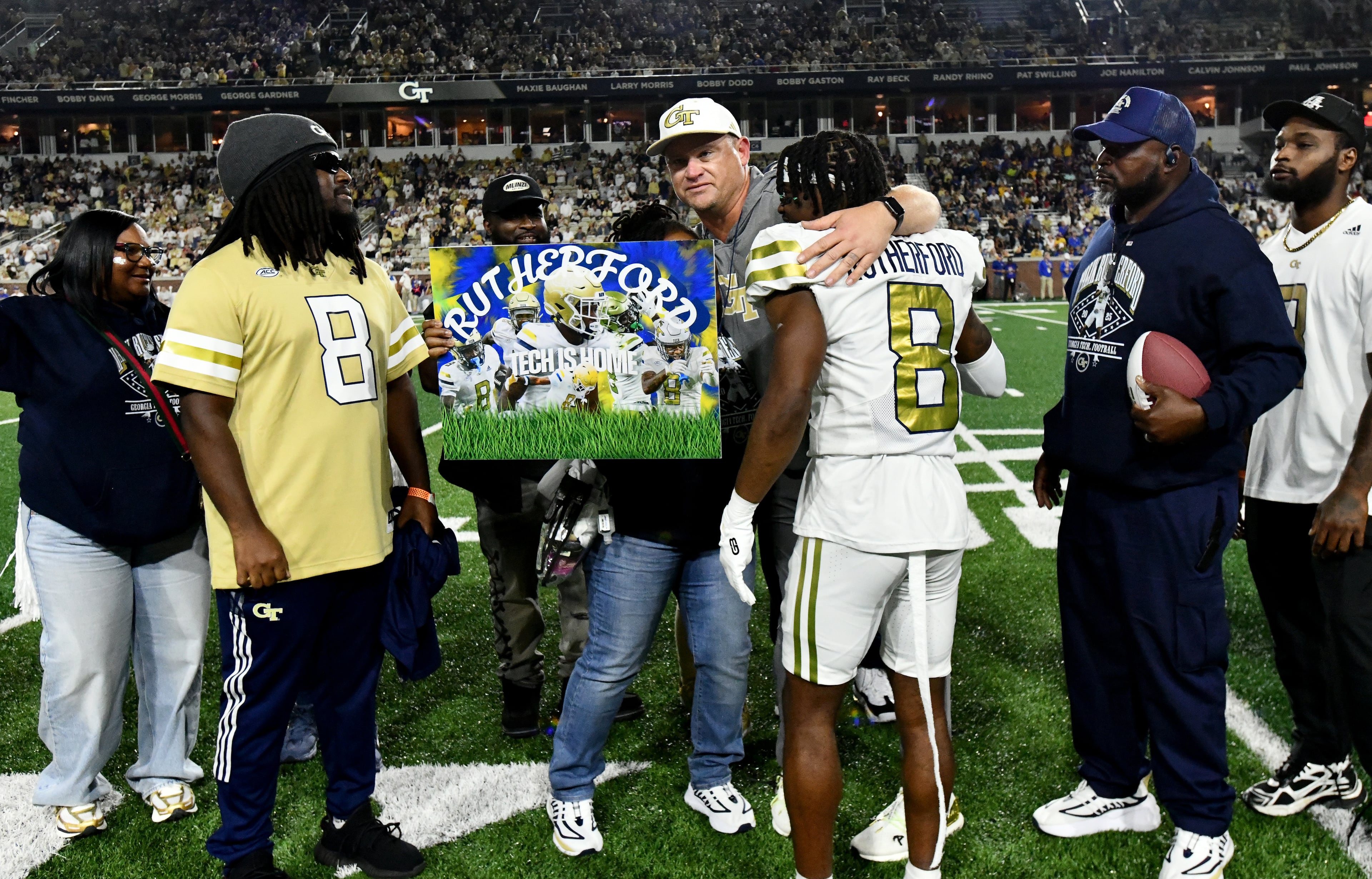 Georgia Tech head coach Brent Key hugs Georgia Tech wide receiver Malik Rutherford during a senior night event prior to the final regular-season home game against Pittsburgh at Bobby Dodd Stadium, Saturday, November 22, 2025 in Atlanta. (Hyosub Shin / AJC)