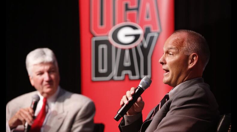 Mark Richt interacts with fans at UGA Day at the College Football Hall of Fame in July. AJC/Michael Carvell