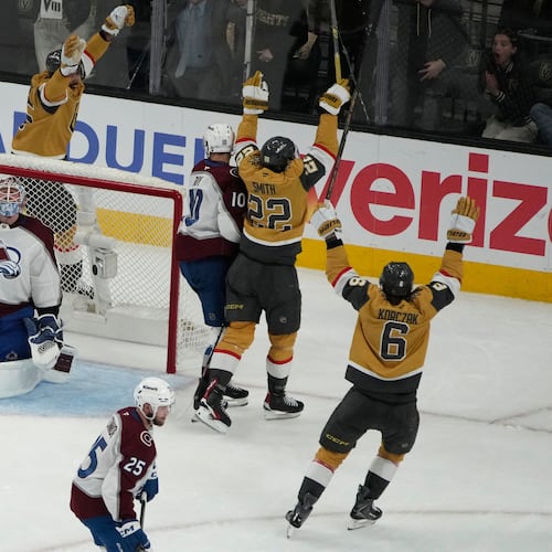 Vegas Golden Knights right wing Cole Smith (22) celebrates after scoring against the Colorado Avalanche during the third period in Game 4 of the Western Conference finals NHL hockey Stanley Cup playoff series Tuesday, May 26, 2026, in Las Vegas. (AP Photo/John Locher)