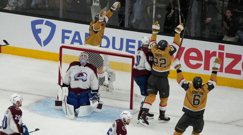 Vegas Golden Knights right wing Cole Smith (22) celebrates after scoring against the Colorado Avalanche during the third period in Game 4 of the Western Conference finals NHL hockey Stanley Cup playoff series Tuesday, May 26, 2026, in Las Vegas. (AP Photo/John Locher)