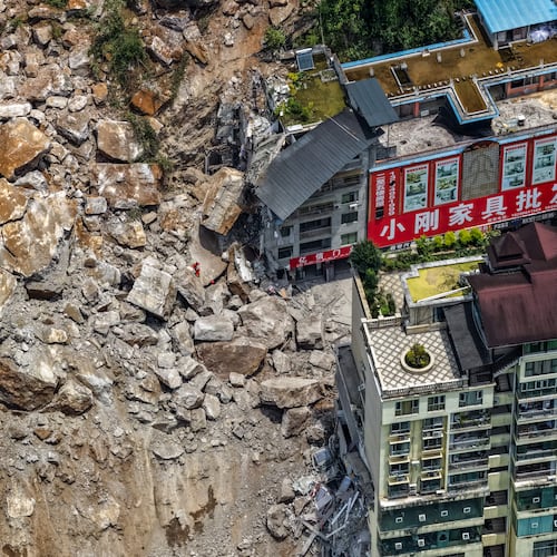 In this photo released by Xinhua News Agency, rescuers conduct search and rescue operation on the site of the landslide in Pengshui County in southwestern China's Chongqing on Friday, July 17, 2026. (Huang Wei/Xinhua via AP)