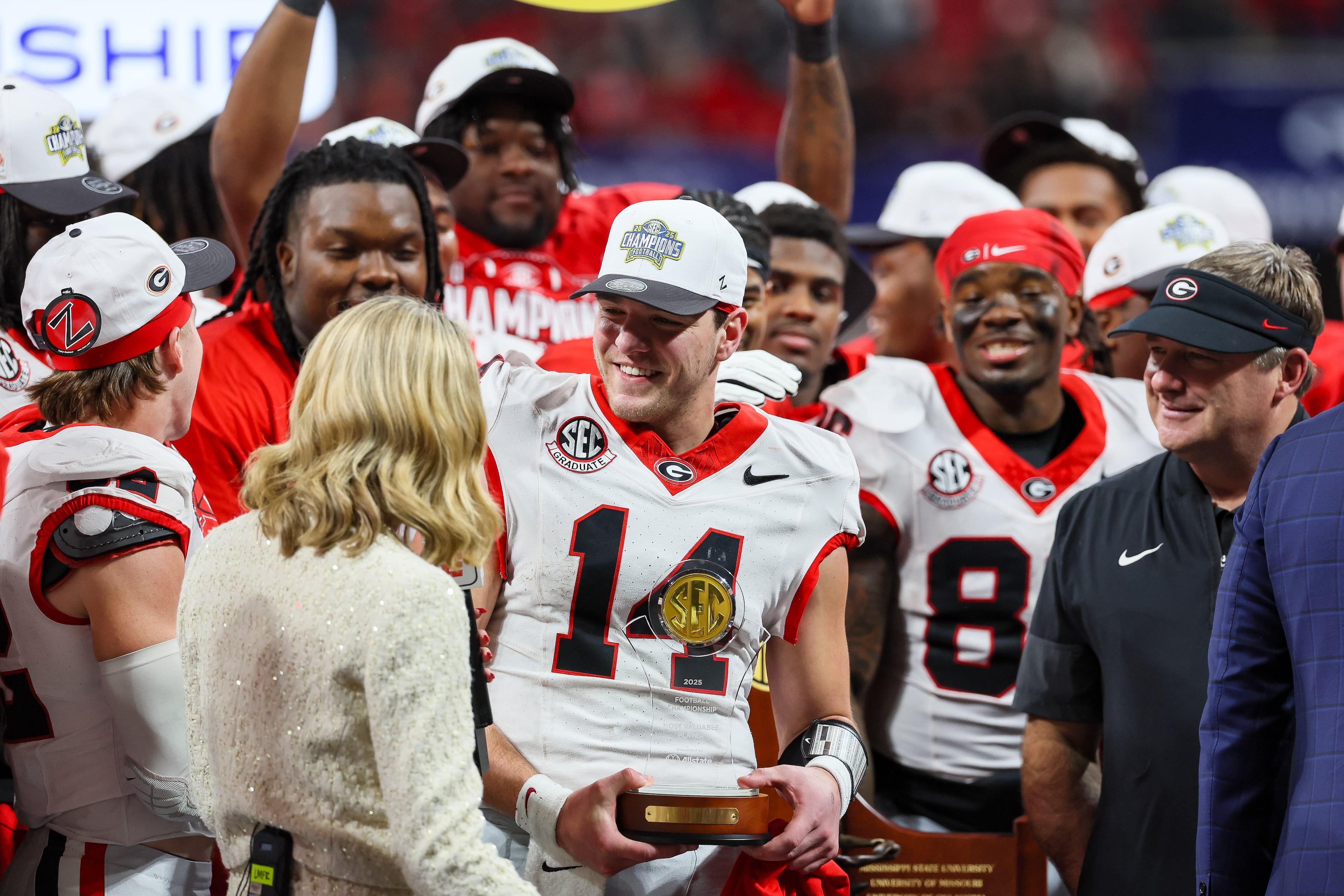 Georgia quarterback Gunner Stockton (14) celebrates a 28-7 victory over Alabama in the SEC Championship game at Mercedes-Benz Stadium, Saturday, Dec. 6, 2025, in Atlanta. (Jason Getz / AJC)