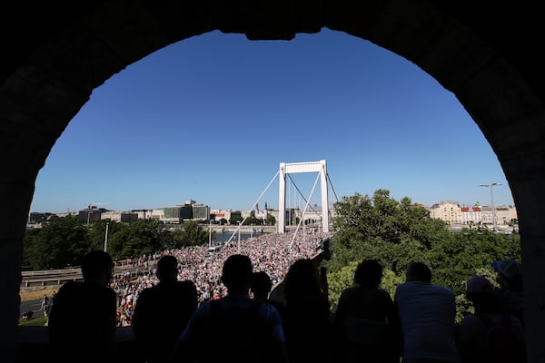Participants in the Pride march cross the Elisabeth Bridge in Budapest, Hungary, Saturday, June 28, 2025. (AP Photo/Rudolf Karancsi)