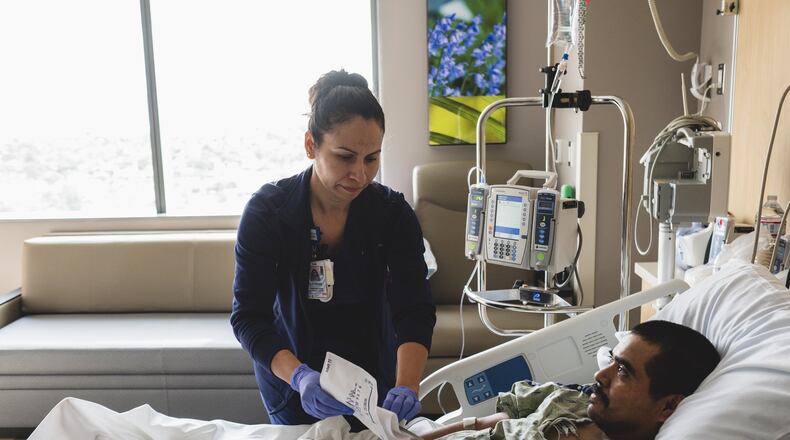 A nurse tends to a patient: Healthcare hiring was strong last month, according to the Georgia Labor Department. (Dominic Valente/The New York Times)